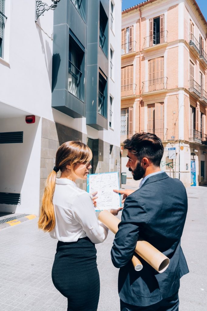 real estate agents talking about documents (1)